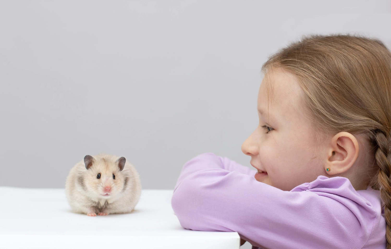 Child Watching His Hamster from a Distance