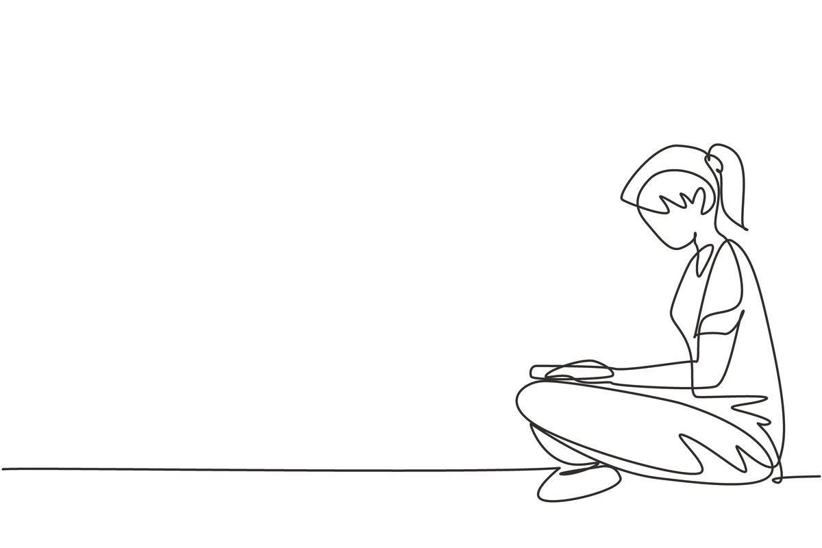 Woman sitting alone drawing