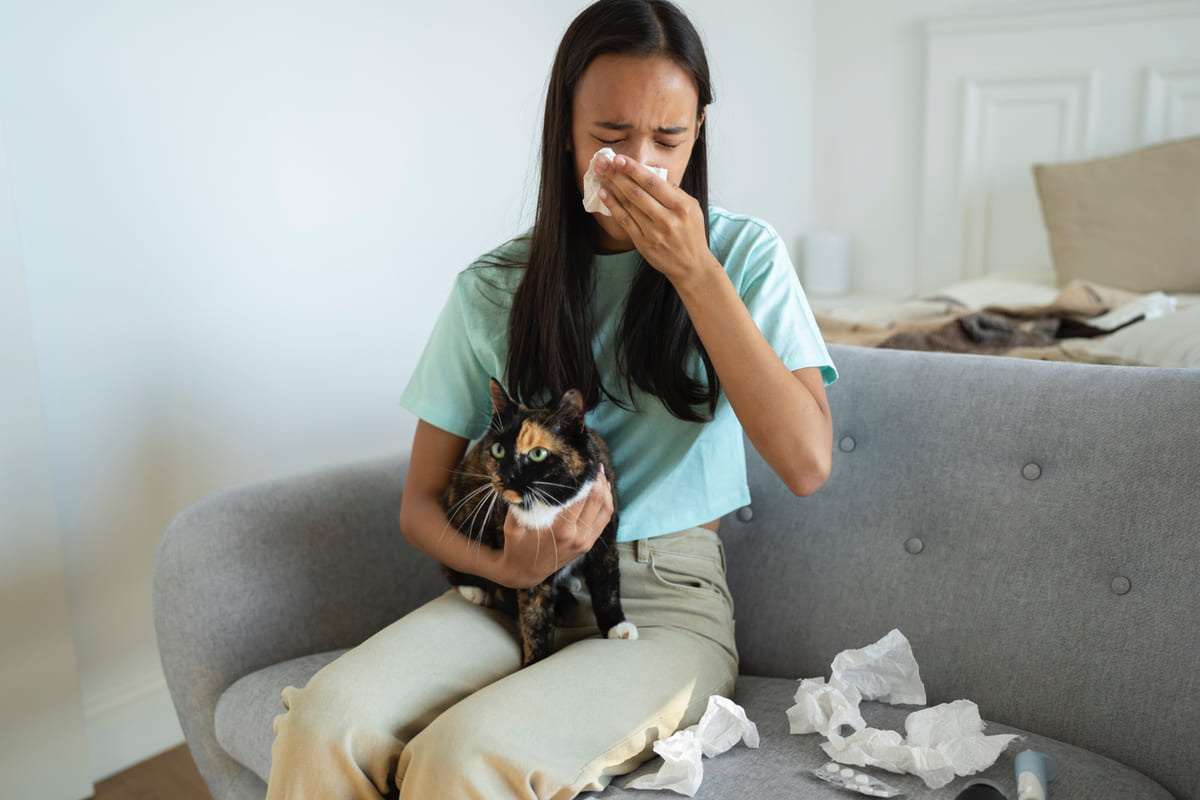 Woman with runny nose due to allergy
